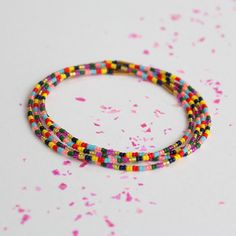 Our best selling 4-stack beaded bracelet is now in a beautiful rainbow! On stretch elastic, glass beads. Made by artisans in the Philippines. Stacked Beaded Bracelets, Pride Bracelet, Lovers Bracelet, Arrow Earrings, Daisy Necklace, Beaded Jewelry Designs, Rainbow Bracelet, Summer Necklace, Beautiful Rainbow