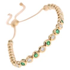 14 Karat Yellow Gold Adjustable and Flexible Emerald & Diamond Bracelet 14 Round Cut Emeralds that weigh 1.42 Carats and 16 Round Cut Diamonds that weigh 1.29 Carats. (Clarity: SI, Color: F) The total carat weight of the bracelet is 2.71 Carats. Beautifully set in 14 Karat Gold Bezel Setting with an adjustable chain to fit your wrist whatever size it may be. Flexible Bracelet, Modern Bracelets, Emerald Diamond, Round Cut Diamond, Bezel Setting, Diamond Bracelet, Round Cut, Jewelry Bracelets, Emerald