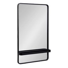 a mirror with a shelf underneath it on a white background and the reflection is in the mirror