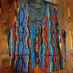 This Coogi Sweater Vest Is In Great Vintage Condition, With No Identifiable Issues. Please Review All Photos For The Condition And Ask Any Questions Prior To Purchase As There Are No Returns Or Cancellations. This Vest Is Not New, It Is A Vintage Coogi Item, So Some Wear Might Be Present. Sold As Is! Measurements Are For Guidance And Might Not Be Exact....Purchase Accordingly. Chest: 19in Length: 21in Check Out My About Me Section For Links To Additional Discounts. Coogi Sweater, Be Present, Blazer Vest, About Me, Sweater Vest, Blazer Suit, Red Blue, Red And Blue, Man Shop