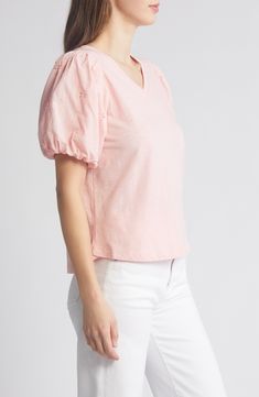 This soft cotton top is designed with a perfectly dipped neckline and eyelet-trimmed puff sleeves. 23" length V-neck Short sleeves 100% cotton Machine wash, tumble dry Imported Casual V-neck Cotton Puff Sleeve Top, Spring Cotton Puff Sleeve Top With Short Sleeves, Cotton Eyelet Puff Sleeve Tops, Cotton Eyelet Tops With Puff Sleeves, Casual V-neck Eyelet Blouse, Feminine Cotton Puff Sleeve Top, Feminine Cotton Blouse With Balloon Sleeves, Fitted Cotton V-neck Puff Sleeve Top, Chic Cotton Eyelet Blouse