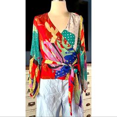 New With Tags Size Xs This Gorgeous Blouse By Conditions Apply Has A Vibrant Colorful Abstract Pattern. The Top Is A Traditional Wrap Style And Ties At The Waist. It Has A V-Neck & Long Sleeves. *This Fabric Wrinkles Very Easily. It Will Arrive Wrinkled. Measurements Laying Flat: Length 21.5” Bust 17.5” Waist 16” Sleeve 22”5” Casual Silk Tops With Vibrant Print, Silk Tops With Vibrant Print And Long Sleeves, Multicolor Silk Top With Vibrant Print, Multicolor Silk Tops With Vibrant Print, Vibrant Red V-neck Top, Chic Tops With Vibrant Print For Brunch, Chic Vibrant Print Tops For Brunch, Vibrant V-neck Top For Spring, Fitted V-neck Blouse With Vibrant Print