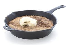 a cast iron skillet with some food in it