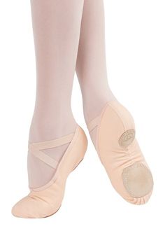 the feet of a ballerina in pink ballet shoes