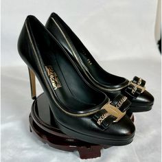 Beautiful And Timeless Black Heels From Famous Designer ‘Salvatore Ferragamo’. 100% Authentic, New In Its Original Box. High Quality Leather With Light Gold (Modern Color) Buckle. Market Value: $1050 (Owner Bought On Sale $745) Sale Price: $545 Condition: Like New. Owner Only Only Unbox, Then Carefully Placed In Box & Designer Shoe Closet. Slightly Sign Of Scratch (Very Tiny) At Shoe Base Due To Trying On. Size: 36.5 Luxury Heels With Leather Sole For Formal Occasions, Luxury Calf Leather Court Shoes For Work, Luxury Heels With Leather Sole For Galas, Designer Round Toe Court Shoes For Business, Luxury Business Heels With Leather Sole, Leather Heels For Galas, Formal Calf Leather Heels, Luxury Calf Leather Heels With Leather Lining, Luxury Heels With Leather Sole For Work