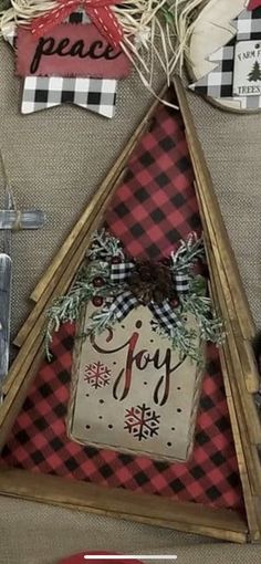 a christmas decoration is hanging on the wall with other decorations and items in front of it