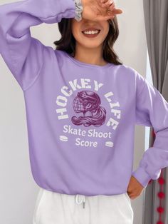 a woman wearing a purple sweatshirt and white sweatpants with the words honey life on it