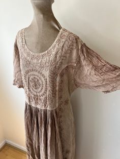 90's embroidered hippie dress. Loose fitting with a tie at the back of the waist. UK Size 12 - 14. Please check measurements: Chest - 102cm Waist - 94cm Length - 136cm Brown Hippie Boho Dress For Spring, Spring Hippie Boho Dress Embroidered, Spring Embroidered Hippie Boho Dress, Hippie Style Flowy Short Sleeve Dresses, Embroidered Short Sleeve Boho Summer Dress, Flowy Short Sleeve Hippie Dresses, Flowy Brown Hippie Dress, Fitted Maxi Dress With Short Sleeves For Festivals, Fitted Maxi Dress For Festivals With Short Sleeves