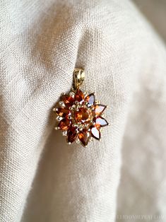 Heirloom Gold Cluster Jewelry, Vintage Yellow Gold Cluster Jewelry, Heirloom Cluster Gold Jewelry, Vintage 14k Gold Cluster Jewelry, 14k Gold Cluster Jewelry With Birthstone, Vintage Cluster Jewelry Gift, Fine Jewelry With 17 Jewels In Cluster Shape, Gold Flower Pendant Jewelry With Prong Setting, Gold Cluster Fine Jewelry