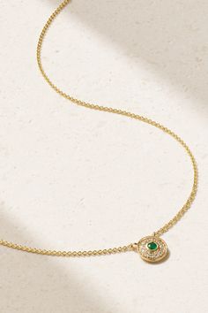 ALMASIKA's 'Petite Universum' necklace is inspired by the shape of concentric circles found in nature, from a ripple in a pond to rings within tree stumps. It's handmade from 18-karat gold that's polished to a high shine and set with a single emerald encircled with sparkling diamonds. Wear it on its own with a plunging neckline. Exquisite Round May Birthstone Necklace, Elegant Gold Emerald Necklace With Round Pendant, Elegant Gold Emerald Necklace, Luxury Emerald Necklace With Round Pendant, Polished Finish Pendant Necklace For May Birthstone, Luxury Gold Round Emerald Necklace, Polished Finish Pendant Necklace With May Birthstone, Elegant Medallion Necklace For May Birthstone, Timeless Halo Necklace With Round Pendant