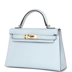 This Kelly, in the Sellier style, is in Bleu Brume epsom leather with gold hardware and has tonal stitching, two straps with front toggle closure, single rolled handle and removable shoulder strap.The interior is lined with Bleu Brume lambskin leather and has one open pocket on the back wall.Collection: YOrigin: FranceCondition: New and never worn (plastic on hardware)Accompanied by: Hermes box, Hermes dustbag, shoulder strap, shoulder strap dustbag, feltMeasurements: 7.5" width x 4.5" height x 2.2" depth; 2.5" handle drop (18" shoulder strap drop) Blue Hermes Bag, Blue Kelly Bag, Mini Kelly Hermes, Hermes Birkin Blue, Kelly Bag Hermes, Hermes Kelly Sellier, Hermes Collection, Kelly Sellier, Mini Kelly