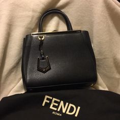 Fendi Black Leather Purse With Gold Hardware. Includes Shoulder Strap And Dust Bag. Used 3 Times. Purchased At Fendi Crystal Mall In Las Vegas. 10” Base Width Height From Top Of Handles 12” Height Of Bag 8 1/2” X 4” Black Leather Purse, Fendi Bags, Leather Purse, Leather Purses, Gold Hardware, Las Vegas, Dust Bag, Fendi, Top Handle Bag