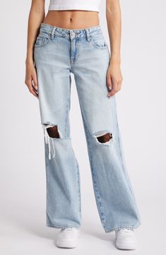 A baggy fit and slashed rips lend an edgier take on casual wide-leg jeans cut from nonstretch denim in a light wash. 32" inseam; 22" leg opening; 10" front rise; 14" back rise (size 29) Zip fly with button closure Five-pocket style 100% cotton Machine wash, line dry Imported Casual Cutoff Flare Jeans In Rigid Denim, Casual Rigid Denim Cutoff Flare Jeans, Trendy Ripped Flare Jeans In Rigid Denim, Relaxed Fit Light Wash Ripped Flare Jeans, Casual Distressed Denim Bottoms, Ripped Relaxed Fit Flare Jeans For Streetwear, Distressed Wide Leg Jeans In Relaxed Fit, Spring Ripped Rigid Denim Flare Jeans, Ripped Flare Jeans In Rigid Denim For Spring