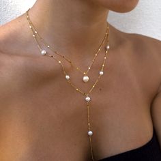 "Our gorgeous freshwater pearl necklaces make the perfect bride, bridesmaid, friend, family gifts. Delicately and carefully handmade with the most excellent and sparkling chain. The dainty minimalist chain dazzles along with our freshwater pearls.  We have the single pearl necklaces or long lariat-style necklace. Each are sold separately.  Wedding/Bridesmaids Discounts:  We offer discounts for multiple pieces, just send us over a message and we will gladly help! We can also put together a gorgeous gift box for your loved ones.  Single Pearl Necklace Length: 16 inches with extra 2\" chain extender Material: Stainless Steel Finish: 18K Gold Plating / Platinum Plating -  PROCESSING TIME -  This piece is handmade to order and is ready to ship in 1-2 business days.  - ABOUT MINKKSI -  https://w Boho Bride Necklace, Long Y Necklace, Delicate Jewelry For Mother's Day Party, Delicate Party Jewelry For Mother's Day, Delicate Mother's Day Party Jewelry, Gold Single Strand Pearl Necklace For Wedding, Akoya Pearl Pendant Jewelry For Party, Mother's Day Round Pearl Necklace, Pearl Clavicle Chain Jewelry For Gift