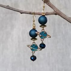 These dangle  earrings are made of deep blue crystal beads, druzy agate beads and enamel pendant are sure to a nice accent to any of your favourite style outfits and are perfect for everyday wear and  create a nice mood . This pair is also lightweight, which makes them especially comfortable to wear. Measurements: length 2.1 inches (5,5 cm) Thank you for visiting my shop! Blue Agate Dangle Jewelry, Blue Agate Earrings As A Gift, Handmade Blue Agate Earrings, Sparrow Earrings, Earrings Space, Space Earrings, Blue Crystal Beads, Saturn Earrings, Planet Earrings