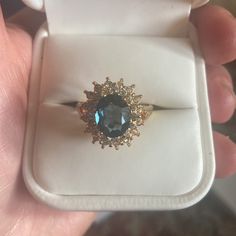 Gorgeous 14k Gold And Blue Sapphire Center Stone. Diamonds On The Outside. Never Worn, In Original White Leather Ring Box With Ravello Signage And White Box. Would Make Excellent Gift As New And All Intact Casings. Got This From My Mom. Looks Very Exquisite And Expensive, Quality. Added Pics Form Website To See The Brand/Qualities. Please Look Up Ravello Beverly Hills For Info On The Brand. Sapphire Cluster Ring For Formal Occasions, Formal Sapphire Cluster Ring With High Clarity, Heirloom Jewelry With Accent Stones For Proposal, Yellow Gold Gemstone Jewelry For Proposal, Proposal Jewelry In Yellow Gold With Gemstones, Formal Yellow Gold Jewelry With Accent Stones, 14k Gold Sapphire Jewelry With Halo Setting, Yellow Gold Gemstone Cluster Ring For Proposal, Gold Rings With Halo Setting And Blue Topaz