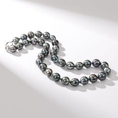 Experience the mysterious allure of the ocean with our Tahitian South Sea Baroque Pearl Strand Necklace. The AA+ quality guarantees uniqueness in each Baroque pearl, offering an unparalleled lustrous sheen. Embrace the natural, irregular beauty of these exotic pearls, and make a bold and sophisticated statement. Ideal for those looking to add an extraordinary touch to their jewelry collection. Necklace Length: 18'' (45cm). 20" (51cm), 22" (56cm), 24"(61cm) Product Information Pearl Type Tahitian Luxury Pearl Necklace With Polished Beads, Luxury Pearl Necklace With Round Gemstone Beads, Luxury Akoya Pearl Gemstone Necklace, Luxury Tahitian Pearl Necklace, Silver Tahitian Pearl Necklace With High Luster, Tahitian Pearl Necklace For Wedding, Luxury Tahitian Pearl Necklace For Formal Occasions, Luxury Tahitian Pearl Round Bead Necklace, Luxury Tahitian Pearl Necklace With Round Beads