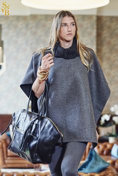 Show off your #casualchic and #luxurylifestyle with our original and reversible Knit Collar Poncho paired with our Palmero Soho Tote. #stickandball #poncho #ponchostyle #leathertote #bag #wintercasual #luxurylifestyle #outfitidea Chic Cashmere Cape For Winter, Oversized Chic Wool Poncho, Luxury Cape For Fall, Chic Wool Poncho For Winter, Wool Poncho For Workwear, Luxury Winter Poncho, Chic Winter Poncho With Batwing Sleeves, Chic Fall Poncho Cape, Chic Batwing Sleeve Winter Poncho