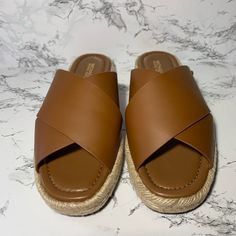 New And Never Used Linden Slides Brown Leather Sz 8 Michael Kors Slides Brown, Beach Mules With Leather Footbed And Round Toe, Slip-on Wedge Sandals With Leather Footbed For Vacation, Brown Mules With Cork-bed Midsoles For The Beach, Brown Open Heel Mules For The Beach, Brown Open Heel Mules For Beach, Brown Open Toe Sandals For Outings, Synthetic Closed Toe Mules For Vacation, Chic Closed Toe Footbed Sandals For Beach