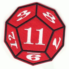 a red and black patch with white numbers on the front, and an image of a dice