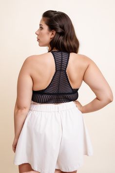 Looking for a cute and comfy bralette that actually fits? Look no further than our Ribbed Lace Boho Racerback Bralette Plus! Made with ultra-soft ribbed fabric and pretty lace detailing, this bralette is designed to flatter your curves. The racerback silhouette is perfect for layering under tanks and tees, and the adjustable straps ensure a perfect fit. Whether you wear it as part of your everyday wardrobe or for a special night in, our Ribbed Lace Boho Racerback Bralette Plus is sure to become Stretch Lace Tops Bra Friendly, Spring Seamless Racerback Bra, Bra Friendly Racerback Crop Top For Loungewear, Chic Lace Crop Top Bra Friendly, Seamless Stretch Lace Bra, Stretch Camisole Bra With Delicate Lace, Lace Stretch Crop Top With Built-in Bra, Spring Stretch Bra With Lace Trim, Stretch Lace Trim Bra