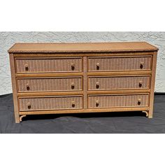 a wicker dresser with six drawers on top