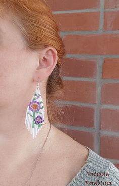 These handmade unique earrings with abstract floral print are made of high-quality Czech beads and strong synthetic thread. I use my author's scheme . They are elegant, fashionable, and highly versatile, suitable for everyday wear. Color: white,pink,purple,red,orange, green . 100% hand made with love! I beg you not to copy my authoring Copy without my permission is prohibited For those who want to buy my copyright scheme for these earrings: https://www.etsy.com/uk/listing/974991392/brick-stitch- White Flower-shaped Jewelry With Dangling Beads, White Beaded Earrings For Summer, White Beaded Earrings For Summer Gift, Summer White Beaded Earrings For Gift, Summer White Beaded Earrings Gift, Summer White Flower Earrings With Colorful Beads, Handmade White Jewelry For Summer, White Handmade Adjustable Earrings, White Dangle Flower Earrings With Colorful Beads