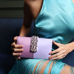 Fashion is a journey - make yours as colorful as a field of irises in full bloom! Wrapped in shades of violet, this clutch is a nod to the rejuvenating spirit of spring that you carry within you. Whether you're brunching in blossoms, parading at carnivals or celebrating Easter elegance, our Iris Crystal Braided Clutch will be on rotation through your 2024 spring-summer social calendar. Composition Crystal braided flap on color block faux silk clutch Lush velvet lining and an additional metal cha Luxury Purple Clutch For Evening, Elegant Purple Clutch For Events, Elegant Purple Clutch For Event, Purple Clutch For Gift, Rectangular Evening Bag For Spring Events, Elegant Purple Rectangular Evening Bag, Spring Event Rectangular Evening Bag, Purple Rectangular Clutch For Formal Occasions, Elegant Spring Gift Clutch