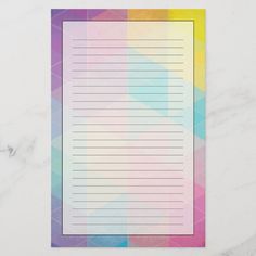 a rainbow colored paper with lines on it