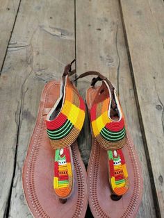 This African beaded Masai sandals are made from leather and beads which comes in different colours of ones choice. It can be customized in terms of size,pattern and colour. They can be worn at any given time, wether in weddings, parties, holidays at the beach and home. Note:This listing is for one pair,  but we do both wholesale and retail Traditional Multicolor Ankle Strap Sandals, Multicolor Beaded Leather Flip Flops, Multicolor Leather Beaded Flip Flops, Leather And Beads, Beaded Sandals, African Beads, Bead Leather, Size Pattern, Strappy Sandals