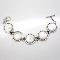 Thai designer Michael Dawkins vintage sterling silver chain bracelet, made of round Mother of Pearl links with caviar design connectors and toggle clasp. This splendid bracelet is 7 1/2" long, 15/16" at the widest, weighing 41 grams or 1.32 ozs Troy. EA5411 Formal Bracelets With Toggle Clasp, Classic Sterling Silver Round Bracelet, Classic White Round Chain Bracelet, White Sterling Silver Round Bracelet, Nickel-free Chain Bracelet For Formal Occasions, Nickel-free Round Chain Bracelet For Formal Events, Nickel-free Classic Sterling Silver Bracelet, Formal Nickel-free Chain Bracelet, Classic Sterling Silver Nickel-free Bracelet