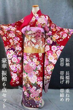 This furisode (long-sleeved kimono) has a shibori pattern, auspicious flowers, and a flower wheel on a reddish-purple silk ground that has been silver-worked. Flowers such as cherry blossoms and veins of leaves are gilded, and the upper front is gorgeously embroidered with gold and silver threads, making this furisode gorgeous. Contents of set Furisode (long-sleeved kimono) Long underwear Obi (sash) Obiage Obijime Half Collar Kimono Furisode, height (from the top of the shoulders): approx. 176.0 cm (height cannot be taken out/impossible to take out) Sleeve length of furisode sleeves: Approx. 102.5 cm Length of kimono from sleeve to sleeve: about 65.5 cm (you can leave about 6.5 cm out of the sleeve) Front width: approx. 24.0 cm / Back width: approx. 30.0 cm Obi Width: approx. 31.0 cm, Leng Luxury Purple Silk Kimono, Obi Sash, Reddish Purple, Shibori Pattern, Long Sleeve Kimono, Shibori Silk, Luxurious Wedding, Flowers Red, Japanese Patterns