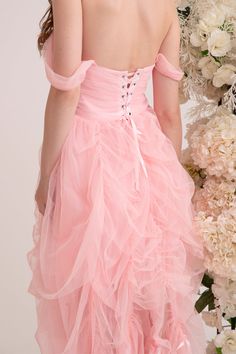 Step into a fairytale in the enchanting Aurora Dress. Crafted from the softest pink tulle, this gown feels like floating on a cloud. Cascading layers of draperies create a gorgeous, flowing silhouette that moves gracefully with every step. Lined with duchess satin, this piece is adorned with dreamy ribbon trims. Delicate off-shoulder sleeves and intricate corset lacing complete the romantic look. Handmade with love for the modern princess, the Aurora Dress is designed to be cherished and treasur Cascading Layers, Corset Lacing, Aurora Dress, Modern Princess, Duchess Satin, Corset Lace, The Aurora, Pink Tulle, Romantic Look