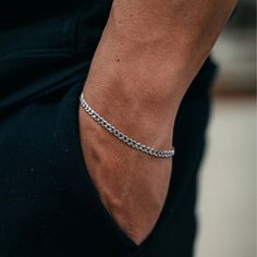 The Silver Cuban Link Bracelet is the perfect bracelet to go with any fit, making you feel more sophisticated and confident every time you wear it. ● Materials: - 316L Stainless Steel ● Chain Type: - Link Chain ● Sizing: - 3mm width ● Durability: - All Livin Well Jewelry is tough, durable, and rust-proof. It won't discolor or turn your skin green. It's waterproof, perfect for showers, pools, and water activities. You can even wear it while working out or in hot and sweaty conditions. ● Warranty:  - Still not sure if this piece is for you? Don't worry, all of our jewelry comes with a lifetime warranty. If you are not satisfied with the quality or it breaks, you can request a refund. Cuban Chain Bracelet, Mens Chain, Minimal Jewellery, Minimal Bracelet, Luxury Jewelry Box, Mens Chain Bracelet, Cuban Bracelet, Mens Bracelet Silver, Gold Armband