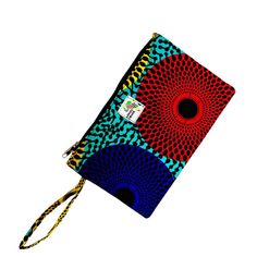 Colorful Ghanian wax print clutch wristlet to leave you hands-free while out-and-about. Holds all the essentials and more. Order it to match your backpack and duffel bag or as a stand-alone accessory. This is your new purse! Size 11” w x 7” h with 8” wrist strap Cheap Wristlet With Wrist Strap For On-the-go, Cheap Multicolor Wristlet, On-the-go Wristlet With Removable Pouch, On-the-go Wristlet Clutch With Wrist Strap, Multicolor Rectangular Wristlet With Strap, Printed Clutch, Wax Print, Wrist Strap, Duffel Bag