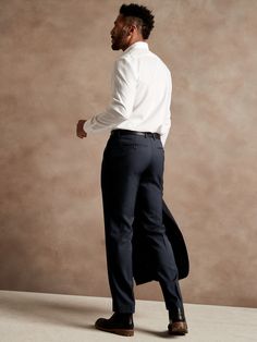 Clean lines and impeccable tailoring meet our luxuriously smooth and lightweight Italian wool.  Woven by masters of textile innovation at Italy's Marzotto mill, this suit pant is designed for all-season wear, with a straight cut through the leg so it Tailored Dress Pants In Suiting Fabric For Office Wear, Elegant Suiting Fabric Bottoms For Office Wear, Elegant Bottoms In Suiting Fabric For Office, Semi-formal Slim Fit Suits With Straight Pants, Wool Business Dress Pants, Slim Fit Suits With Straight Pants For Semi-formal Occasions, Slim Fit Office Suits Trousers, Fitted Modern Dress Pants, Elegant Dress Pants In Suiting Fabric For Office