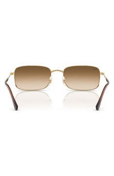 A sleek rectangular silhouette adds retro-cool appeal to stylish sunnies fitted with adjustable nose pads for a secure fit. 59mm lens width; 20mm bridge width; 145mm temple length 100% UV protection Adjustable nonslip nose pads Metal Imported Classic Rimless Aviator Sunglasses With Tinted Lenses, Classic Rimless Sunglasses For Summer, Classic Rimless Tinted Aviator Sunglasses, Classic Rectangular Sunglasses For Summer, Classic Rimless Aviator Sunglasses With Uv Protection, Luxury Rectangular Sunglasses With Gradient Lenses, Gold Rectangular Sunglasses With Tinted Lenses, Classic Rimless Shield Sunglasses For Summer, Gold Rectangular Sunglasses With Mirrored Lenses