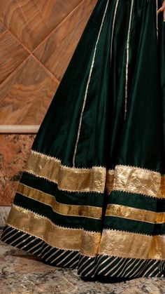 Baisa Dark Green Cotton Silk Lehenga Set for Women - Free Shipping & Easy Returns – Fledgling Wings Green Silk Anarkali Set With Embroidered Border, Green Silk Cutdana Sets, Green Cotton Silk Traditional Wear With Embroidered Border, Green Traditional Wear With Embroidered Cotton Silk, Designer Wear Green Sharara With Embroidered Border, Designer Green Sharara With Embroidered Border, Elegant Cotton Silk Anarkali Set With Dori Work, Designer Silk Sharara With Embroidered Border, Festive Green Anarkali Set With Embroidered Border