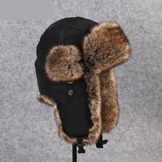 You will love this unisex bomber which is made of acrylic fibre and fur for the middle-aged youth. The Russian ushanka ear protection cap will give you great protection from cold during winter. This unisex faux trapper hat has a solid pattern and is in an all-time favorite black color with a shade of brown.

Specifications
Brand Name: GeraldBlack
Gender: Unisex
Department Name: Adult
Pattern Type: Solid
Item Type: Bomber Hats
Model Number: B-8526
Material: Fur
Applicable object: Middle age youth Black Hat With Faux Fur Lining And Ear Flaps, Black Aviator Hat For Outdoor, Black Hats With Plush Lining And Ear Flaps, Black Hats With Plush Lining For Cold Weather, Black Insulated Winter Hat, Insulated Black Winter Hat, Russian Ushanka, Fur Trapper Hat, Fur Trapper