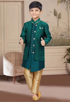 Art Silk Jacquard Layered Sherwani in Teal Green This Readymade Chinese Collar Neck and Full Sleeve attire is Enhanced with Buttons and Moulded Buttons Available with an Art Dupion Silk Pajama in Beige Do note: Accessories shown in the image is for presentation purposes only. Half to one inch may vary in measurement. (Slight variation in actual color vs. image is possible) Kids Wedding Outfits Boys, Sherwani For Boys, Kids Sherwani, Baby Boy Birthday Outfit, Indowestern Sherwani, Kids Wedding Outfits, Silk Pajama, Woven Art, Indo Western Dress