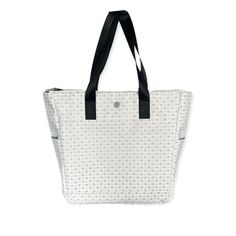 The GP On-the-go tote is inspired by the U.S. OPEN. It's the ultimate tote to be carried on and off the court. Its sleek design will make you want to take it everywhere you go. Our tote comes with a GP Silver keychain. Compact and functional, designed for comfort and elegance. There's a place for everything. Finally, keep all your things perfectly organized. Suitable for Pickleball, tennis, padel, and lifestyle. With every feature, this bag makes for a unique, modern, and essential carry-on. Fea White Sporty Bag With Removable Pouch, Sporty Tote Shoulder Bag For Shopping, Casual White Reversible Shoulder Bag, Sporty White Tote Shoulder Bag, Sporty White Bag For Everyday Use, White Reversible Bag, Sporty White Shoulder Bag For On-the-go, White Bags With Reinforced Double Handles, Modern White Bags With Reinforced Handles