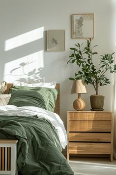 a bed room with a neatly made bed and two planters on the nightstands