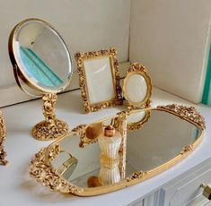 an ornately decorated vanity with three mirrors