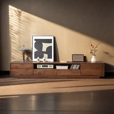 a living room with a wooden entertainment center