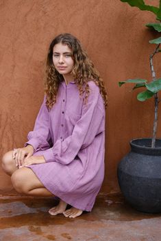 Introducing the Artist Smock, a collaboration between Audrey E Leary and World of Crow. This pink dual-tone smock is crafted from thick, handwoven organic cotton and features a straight collar, puff full sleeves, and spacious pockets. With a short length and gathered cuffs, it offers a comfortable fit and is perfect for painting, crafting, and staying cozy during travel. Fall Cotton Tunic For Loungewear, Long Sleeve Tunic With Pockets For Daywear, Relaxed Fit Cotton Tunic With Pockets, Cotton Tunic With Pockets And Relaxed Fit, Casual Long Sleeve Tunic With Pockets, Casual Tunic With Pockets For Daywear, Relaxed Fit Tunic With Pockets For Daywear, Casual Long Sleeve Tunic For Loungewear, Casual Oversized Tunic With Pockets