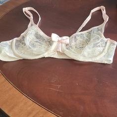 Nwot Victoria's Secret Underiire Cream Lace With Pale Pink And Blue Embroidery. Circa 1984. Size: 34c Feminine Pink Sheer Bra, Pink Lace Trim Bra For Wedding, Wedding Bra With Pink Lace Trim, Wedding Bra With Lace Trim In Pink, Pink Lace Trim Wedding Bra, Pink Coquette Underwire Bra, Pink Feminine Bra For Wedding, Pink Feminine Wedding Bra, Fitted Pink Bra For Wedding