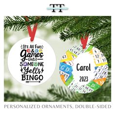 two personalized christmas ornaments hanging from a tree