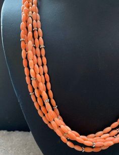 Sterling Silver Multi Strand Pink Coral Bead Necklace. 22 inch Formal Single Strand Necklace With Oval Beads, Formal Single Strand Jewelry With Oval Beads, Formal Single Strand Oval Beads Jewelry, Elegant Rondelle Beaded Necklaces With Large Beads, Elegant Necklace With Large Oval Beads, Classic Beaded Jewelry With Oval Beads, Elegant Orange Beaded Necklaces With Gemstone Beads, Elegant Orange Jewelry With Polished Beads, Elegant Orange Beads For Jewelry Making