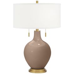 Bring exquisite style and designer color home with the Toby Color + Plus table lamp in beautiful Mocha. The design is hand-crafted by experienced artisans in California, and is completed by an elegant brass finish base and pull chains. A plain drum shade sits on top, drawing the look together in contemporary style. A tabletop dimmer is included for added convenience. Lamp base U.S. Patent # 8,899,798. Brass Accent Table, Top Drawing, Color Home, Light Pull, Mocha Brown, Contemporary Glass, Brass Accents, Pull Chain, Glass Table Lamp