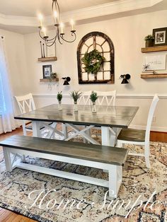 a dining room table and bench in front of a window